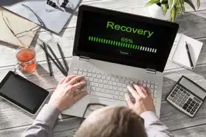 A computer downloading data after disaster recovery