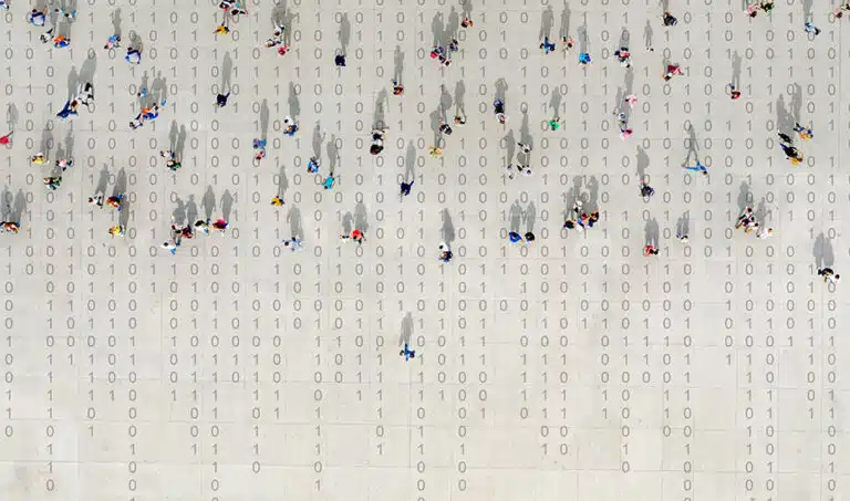 A data privacy concept illustration with people show walking across binary code.