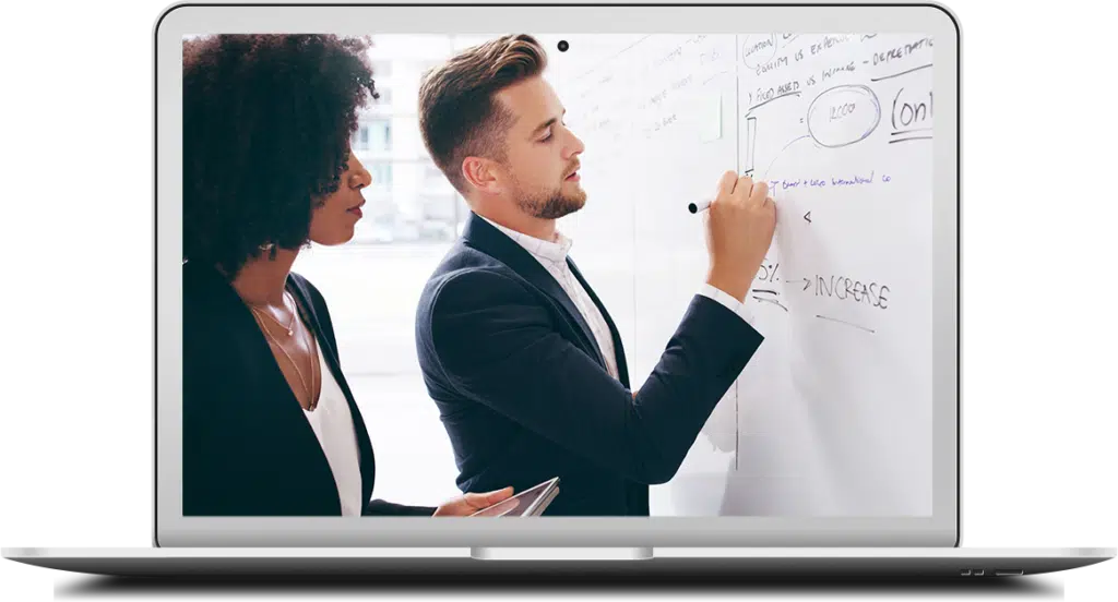 An businessman and businesswoman brainstorm and strategize on a whiteboard to identify the true cost of information technology within their organization.
