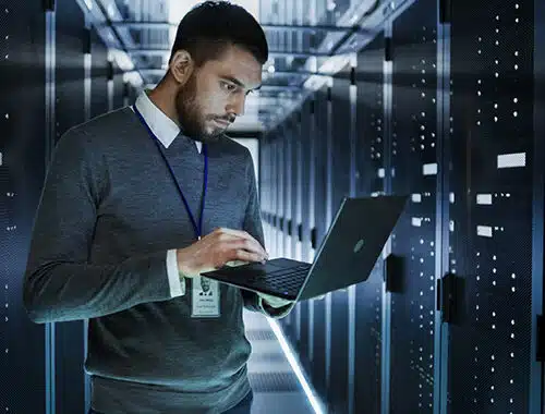 Network administrator and security professional runs a diagnostic on a server and remediates security vulnerabilities of critical patches to prevent online threats from compromising the network.