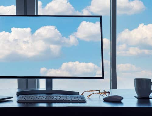 A computer and window with cloud backups, a metaphor for what you can do with Microsoft Endpoint Manager.