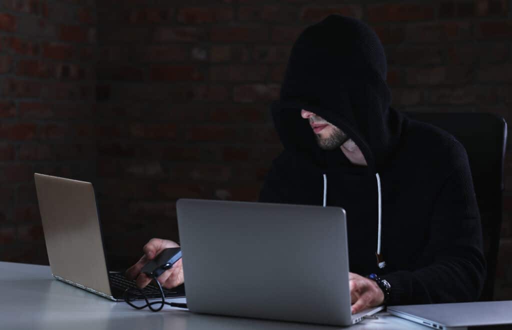 A hacker struggling to bypass a device protected by an MDM-enabled security setting